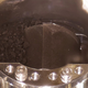 Dark pebbles and dust seen inside Hayabusa2's storage chamber.